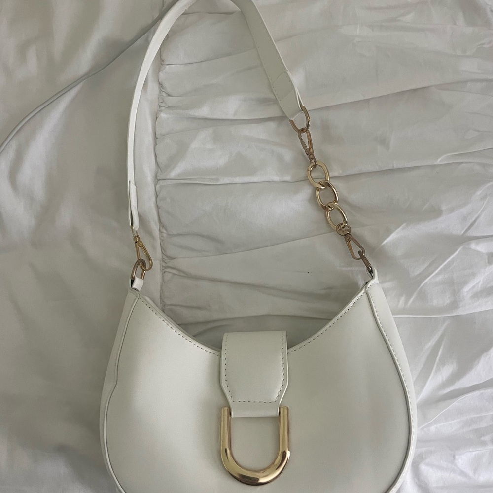 Elegant White Handbag with Gold Accents